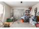 Garage interior featuring ample storage space and a roll-up door at 4031 N 81St Ave, Phoenix, AZ 85033