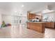 Spacious kitchen with tile floors, wooden cabinets, and sliding glass doors to the backyard at 4031 N 81St Ave, Phoenix, AZ 85033