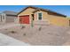 Charming single-story home boasts a brick driveway, a two-car garage, and low-maintenance desert landscaping at 4154 W Jeanette Ln, San Tan Valley, AZ 85144
