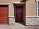 Inviting front entrance with a modern door and stone accents that frame the entry for added curb appeal at 4154 W Jeanette Ln, San Tan Valley, AZ 85144