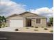Charming single-story home with a two-car garage, desert landscaping, and a neutral color palette at 4293 E Brook Lynn Pl, San Tan Valley, AZ 85143