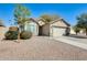 Charming single-story home with desert landscaping, and a well-maintained front yard at 4332 W Carson Rd, Laveen, AZ 85339