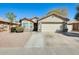 Charming single-story home featuring a two-car garage and a low maintenance desert landscape at 4332 W Carson Rd, Laveen, AZ 85339