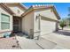 Close up of the home's front exterior, highlighting the garage and entryway at 4332 W Carson Rd, Laveen, AZ 85339