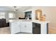 Bright kitchen features white cabinets, quartz countertops, and stainless-steel dishwasher at 4332 W Carson Rd, Laveen, AZ 85339