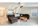 Spacious living room features a large, comfortable sofa and an ornamental coffee table at 4332 W Carson Rd, Laveen, AZ 85339