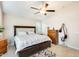 Comfortable main bedroom features king bed, a ceiling fan, and neutral colors at 4332 W Carson Rd, Laveen, AZ 85339