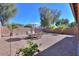 Expansive backyard with gravel landscaping and a seating area perfect for gatherings and relaxation at 43409 W Sagebrush Trl, Maricopa, AZ 85138
