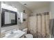 Bathroom featuring a vanity, mirror, and shower with a curtain at 43409 W Sagebrush Trl, Maricopa, AZ 85138