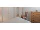 Bedroom with a bed and a dresser at 43409 W Sagebrush Trl, Maricopa, AZ 85138