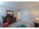 Bedroom featuring a dresser with TV and closet at 43409 W Sagebrush Trl, Maricopa, AZ 85138