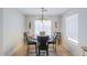 Cozy dining area with a round table and four chairs at 43409 W Sagebrush Trl, Maricopa, AZ 85138