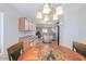 Dining area with view to the kitchen and stainless steel appliances at 43409 W Sagebrush Trl, Maricopa, AZ 85138