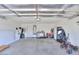 Spacious garage with ample room for vehicles and storage, featuring a clean and well-lit interior at 43409 W Sagebrush Trl, Maricopa, AZ 85138