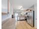 Spacious kitchen featuring stainless steel appliances and tile flooring at 43409 W Sagebrush Trl, Maricopa, AZ 85138