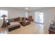 Comfortable living room featuring neutral colors, tile floors and backyard access at 43409 W Sagebrush Trl, Maricopa, AZ 85138