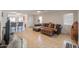 Comfortable living room featuring neutral colors, tile floors and backyard access at 43409 W Sagebrush Trl, Maricopa, AZ 85138