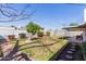 Fenced backyard featuring a covered patio and landscaped garden at 4510 W Keim Dr, Glendale, AZ 85301
