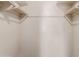 Empty closet with two levels of shelving, ideal for clothing storage and organization at 4510 W Keim Dr, Glendale, AZ 85301