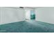 Neutral room with soft teal carpeting and white walls, offering a blank canvas for personalization at 4510 W Keim Dr, Glendale, AZ 85301