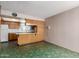 Kitchen area featuring wood cabinets, tiled floors, and plenty of countertop workspace at 4510 W Keim Dr, Glendale, AZ 85301