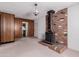 Cozy living room features a rustic brick fireplace and adjacent doorway at 4510 W Keim Dr, Glendale, AZ 85301