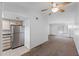 Living area with kitchen view featuring stainless steel refrigerator and ample natural light at 461 W Holmes Ave # 383, Mesa, AZ 85210