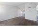 Bright living room with ceiling fan and carpet with easy patio access at 461 W Holmes Ave # 383, Mesa, AZ 85210