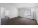 Neutral living room with carpet, window, and white walls is ready for furnishings at 461 W Holmes Ave # 383, Mesa, AZ 85210