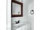 The bathroom offers modern fixtures, clean finishes, and a sleek mirror at 4955 E Indian School Rd # 5, Phoenix, AZ 85018