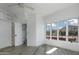 Airy bedroom featuring hardwood floors, recessed lighting, and large windows showcasing scenic mountain views at 4955 E Indian School Rd # 5, Phoenix, AZ 85018