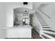 Modern kitchen with stainless steel appliances and white cabinetry next to a staircase at 4955 E Indian School Rd # 5, Phoenix, AZ 85018