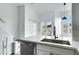 Kitchen with stainless appliances, white cabinets, and doors to a terrace with mountain views at 4955 E Indian School Rd # 5, Phoenix, AZ 85018
