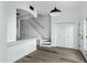 Open floor plan showcases staircase, modern light fixture, and beautiful flooring at 4955 E Indian School Rd # 5, Phoenix, AZ 85018