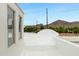 Wide angle view of the white roof showing a mountain view and bright blue sky at 4955 E Indian School Rd # 5, Phoenix, AZ 85018