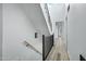 Staircase with modern railings and white walls at 4955 E Indian School Rd # 5, Phoenix, AZ 85018