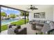 Relaxing covered patio featuring comfortable seating, a fire pit, and a view of the backyard pool area at 5629 E Thunderbird Rd, Scottsdale, AZ 85254