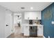 Features a bar area with white cabinetry, a beverage cooler, and decorative accents, adding a touch of elegance at 5629 E Thunderbird Rd, Scottsdale, AZ 85254