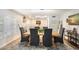 Formal dining room with a large wooden table, elegant chandelier, and decorative accents at 5629 E Thunderbird Rd, Scottsdale, AZ 85254