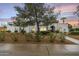 Charming single-story home featuring manicured landscaping and a unique architectural design at 5629 E Thunderbird Rd, Scottsdale, AZ 85254