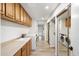 Bright laundry room with ample cabinet storage and modern appliances at 5629 E Thunderbird Rd, Scottsdale, AZ 85254