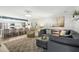 Open-concept living area featuring a spacious layout, stylish seating, and access to the kitchen at 5629 E Thunderbird Rd, Scottsdale, AZ 85254