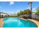 Sparkling pool surrounded by lush landscaping and lounge area at 5629 E Thunderbird Rd, Scottsdale, AZ 85254