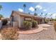Backyard with desert landscaping, sidewalk, and awning at 6200 S Championship Dr, Chandler, AZ 85249