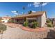 Backyard with desert landscaping, sidewalk, awning and fire pit at 6200 S Championship Dr, Chandler, AZ 85249