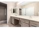 Bathroom featuring double sinks, vanity and a full-sized mirror at 6200 S Championship Dr, Chandler, AZ 85249