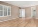 Spacious bedroom featuring hardwood floors, neutral walls and bright, shuttered windows at 6200 S Championship Dr, Chandler, AZ 85249