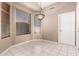 Bright breakfast nook with tile flooring, large window with blinds, and decorative chandelier at 6200 S Championship Dr, Chandler, AZ 85249