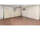 Spacious garage with built-in cabinets and a large garage door at 6200 S Championship Dr, Chandler, AZ 85249