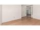 Empty room with light hardwood flooring and white walls at 6200 S Championship Dr, Chandler, AZ 85249